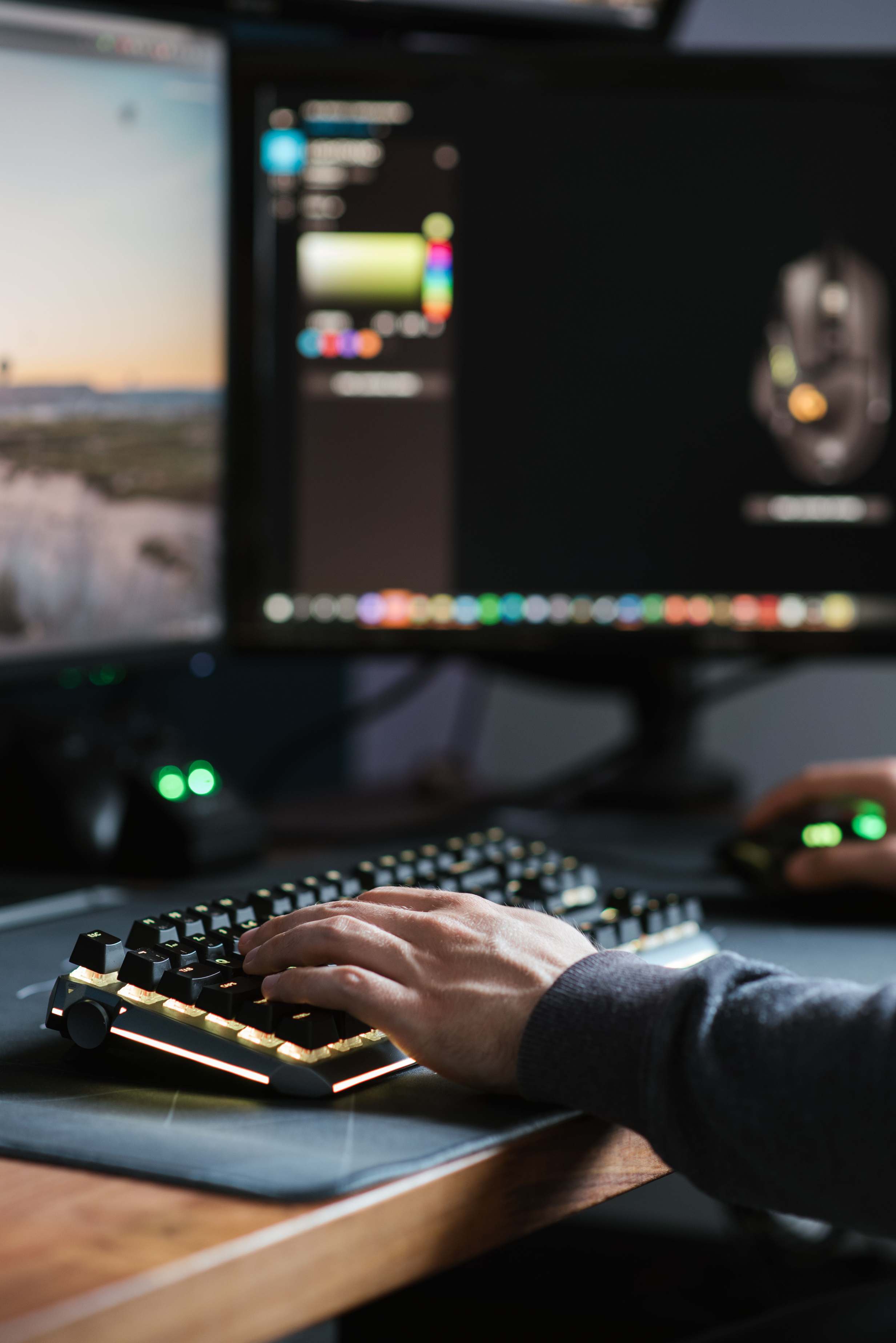 Developer reviewing code on a monitor at a workstation